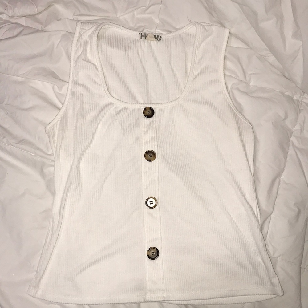 White top with brown buttons